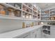 Organized pantry with ample shelving, counter space, and storage for food and kitchen essentials at 2500 Lupine Ln, Wickenburg, AZ 85390