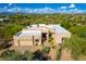 Aerial view of modern home with desert landscaping and a private pool in a lush community at 27467 N 75Th Way, Scottsdale, AZ 85266