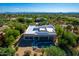 Back aerial view of home featuring a backyard pool, covered patio, and desert landscaping at 27467 N 75Th Way, Scottsdale, AZ 85266