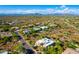 Scenic aerial view of a desert community with mature landscaping and panoramic mountain views at 27467 N 75Th Way, Scottsdale, AZ 85266