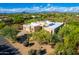 Aerial view of a modern home surrounded by mature desert landscape at 27467 N 75Th Way, Scottsdale, AZ 85266
