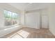 Bright bedroom features a window seat with desert views and a large closet at 27467 N 75Th Way, Scottsdale, AZ 85266