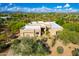 Stunning desert home featuring a flat roof, lush landscaping, and beautiful mountain views at 27467 N 75Th Way, Scottsdale, AZ 85266