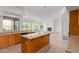 Open-concept kitchen, living room, and fireplace at 27467 N 75Th Way, Scottsdale, AZ 85266