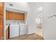 Laundry area with sink and access to hall at 27467 N 75Th Way, Scottsdale, AZ 85266