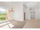 Open concept living space with neutral carpet, foyer access and large windows at 27467 N 75Th Way, Scottsdale, AZ 85266