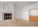 Bright living room with fireplace, wet bar, and tile flooring at 27467 N 75Th Way, Scottsdale, AZ 85266