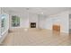Open living room boasts a fireplace, a wet bar area, and large window at 27467 N 75Th Way, Scottsdale, AZ 85266