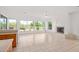 Living space with tile flooring and a fireplace; features backyard views with abundant natural light at 27467 N 75Th Way, Scottsdale, AZ 85266