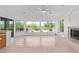 Living space with tile flooring and a fireplace, showcasing backyard and desert views at 27467 N 75Th Way, Scottsdale, AZ 85266