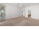 Spacious main bedroom with carpet floors, ceiling fan, and sliding glass door to the patio at 27467 N 75Th Way, Scottsdale, AZ 85266