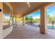 Covered patio featuring durable flooring, ceiling fans, and views of the private pool and desert landscape at 27467 N 75Th Way, Scottsdale, AZ 85266