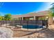 Back of home with a fenced pool and low maintenance natural desert landscaping at 27467 N 75Th Way, Scottsdale, AZ 85266