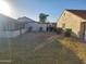 View of a house's backyard with a green lawn and landscaping at 276 Leisure World --, Mesa, AZ 85206