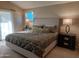 Cozy bedroom featuring a king-size bed with decorative pillows and ambient lighting at 276 Leisure World --, Mesa, AZ 85206