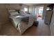 Bright bedroom with a king bed, sliding glass doors, and a view of the outdoors at 276 Leisure World --, Mesa, AZ 85206