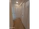 Hallway featuring multiple closets with paneled doors and neutral carpeting at 276 Leisure World --, Mesa, AZ 85206