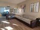Spacious living room with modern decor, wood floors, and light neutral colored walls at 276 Leisure World --, Mesa, AZ 85206