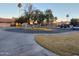 Residential street view in a suburban neighborhood with mature trees and well-maintained lawns at 276 Leisure World --, Mesa, AZ 85206