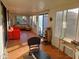 Bright sunroom with tiled floor, offering space for relaxation and exercise equipment at 276 Leisure World --, Mesa, AZ 85206