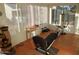 Enclosed sunroom features tiled flooring, exercise equipment and views of the outdoors at 276 Leisure World --, Mesa, AZ 85206