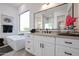 Stylish bathroom with a large mirror, granite countertops, and a modern faucet at 28265 N 158Th St, Scottsdale, AZ 85262