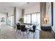 Elegant dining room features a modern chandelier, large windows, and stylish decor at 28265 N 158Th St, Scottsdale, AZ 85262