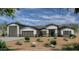 Beautiful exterior elevation with a three car garage, desert landscaping, and charming architectural details at 28265 N 158Th St, Scottsdale, AZ 85262
