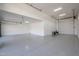 Expansive garage featuring an epoxy floor, ample storage space, and multiple access points for convenience at 28265 N 158Th St, Scottsdale, AZ 85262