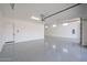 Spacious and well-lit garage with epoxy flooring and ample room for multiple vehicles at 28265 N 158Th St, Scottsdale, AZ 85262