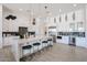 Beautiful kitchen with an island and bar seating, wine fridge, and stainless steel appliances at 28265 N 158Th St, Scottsdale, AZ 85262