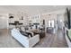 A modern living space that opens to the kitchen, dining area, and butler's pantry at 28265 N 158Th St, Scottsdale, AZ 85262