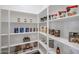 A well-organized pantry with white shelving stocked with various food items at 28265 N 158Th St, Scottsdale, AZ 85262
