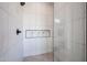 Modern shower with white marble tile, a built-in niche, and a rainfall showerhead at 28265 N 158Th St, Scottsdale, AZ 85262