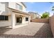 Backyard with a covered patio, gravel landscaping, and block fence at 3794 S Laurel Way, Chandler, AZ 85286