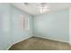 Cozy bedroom with natural light, carpet, ceiling fan, and light blue walls at 4202 E Broadway Rd # 93, Mesa, AZ 85206
