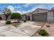 Charming single-story home showcasing a low maintenance desert landscape and an attached two-car garage at 4202 E Broadway Rd # 93, Mesa, AZ 85206