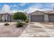 Charming single-story home showcasing a low maintenance desert landscape and an attached two-car garage at 4202 E Broadway Rd # 93, Mesa, AZ 85206