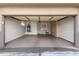 Spacious garage featuring epoxy flooring, built-in cabinets, and utility sink at 4202 E Broadway Rd # 93, Mesa, AZ 85206