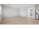 Spacious living area with tile floors, natural light, and a view into the kitchen at 42845 W Vincent Dr, Maricopa, AZ 85138