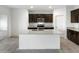 Modern kitchen with stainless steel appliances, granite countertops, and ample cabinet space at 42855 W Vincent Dr, Maricopa, AZ 85138