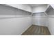 Empty walk-in closet with shelving and carpeted floor at 42855 W Vincent Dr, Maricopa, AZ 85138