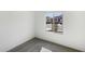 Bedroom with window providing bright natural light and neighborhood views at 42890 W Peters Dr, Maricopa, AZ 85138