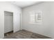 Bedroom featuring carpet, closet, and window with plenty of natural light at 42890 W Peters Dr, Maricopa, AZ 85138