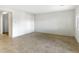 Open-concept living room featuring tile flooring and a view of the backyard at 42890 W Peters Dr, Maricopa, AZ 85138