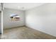 Bright living room with tile flooring and a view of the backyard at 42890 W Peters Dr, Maricopa, AZ 85138