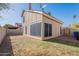 Spacious backyard featuring a patio area, a fenced-in lawn, and desert landscaping at 433 E Utopia Rd, Phoenix, AZ 85024