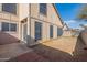 View of the backyard, with a combination of concrete, brick, and sparse landscaping at 433 E Utopia Rd, Phoenix, AZ 85024
