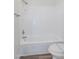 Close-up of a clean white tiled shower-tub combination in bathroom at 433 E Utopia Rd, Phoenix, AZ 85024