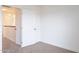 Bright bedroom featuring neutral carpet and an open door at 433 E Utopia Rd, Phoenix, AZ 85024